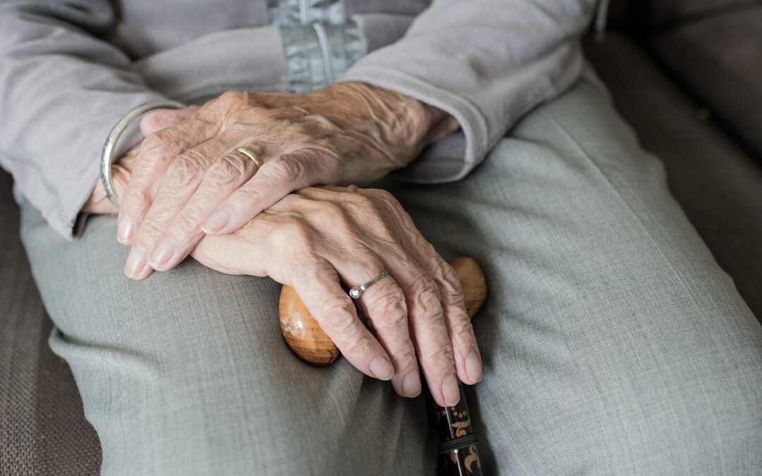 senior crossing their hands on their lap