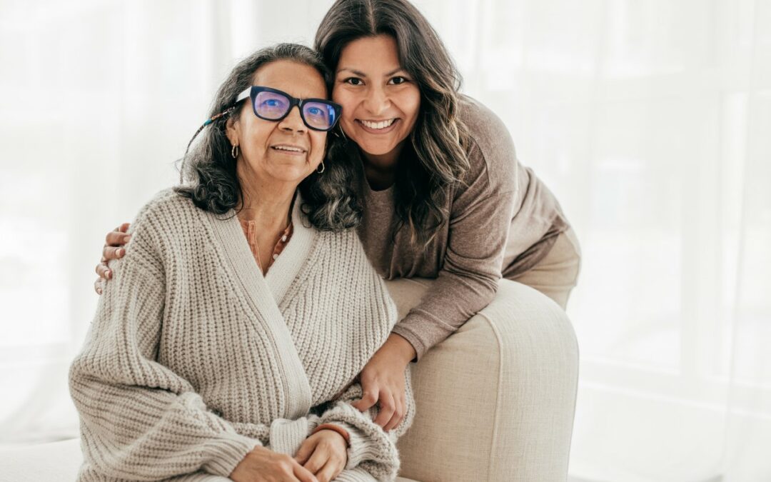 senior woman and her daughter posing for a photo