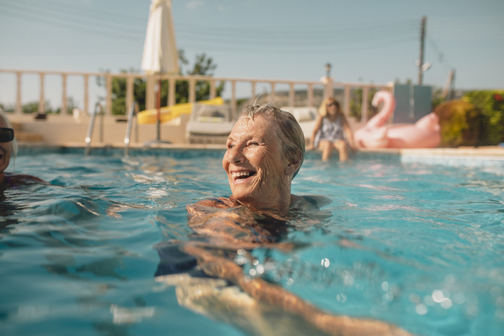 senior woman swimming in a pool